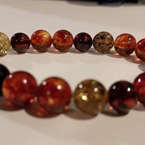 Unisex 7 inch Cognac, Green and Red Baltic Amber stretch bracelet